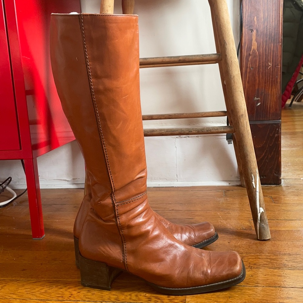 Brown knee high boots.